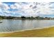 Scenic view of a lake with houses in the background at 11343 Walden Loop, Parrish, FL 34219