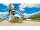 Gated community entrance with guard house and landscaping at 1141 Riverscape St # C, Bradenton, FL 34208