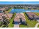 Single-Gathering home with tile roof, located by a lake at 11467 Conch Ct, Venice, FL 34292