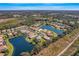 Property view showcasing home's location in a lakefront community at 11467 Conch Ct, Venice, FL 34292