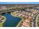 Aerial view of home with water access and lush landscaping at 11467 Conch Ct, Venice, FL 34292