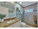 Bathroom with granite countertop, large walk-in shower, and modern fixtures at 11467 Conch Ct, Venice, FL 34292