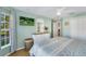 King-size bed, large window with curtains, and a dresser at 11467 Conch Ct, Venice, FL 34292