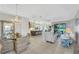 Open floor plan with a spacious living area, dining area, and kitchen at 11467 Conch Ct, Venice, FL 34292