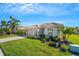 Beautiful home exterior with landscaped yard and driveway at 11467 Conch Ct, Venice, FL 34292