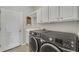 Laundry room with washer, dryer, and cabinets at 11467 Conch Ct, Venice, FL 34292