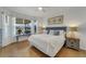 Spacious main bedroom with a king-size bed, and water view at 11467 Conch Ct, Venice, FL 34292