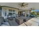 Relaxing screened lanai with seating area and fire pit, perfect for outdoor entertaining at 11467 Conch Ct, Venice, FL 34292