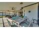 Outdoor dining area on a screened lanai, ideal for al fresco meals at 11467 Conch Ct, Venice, FL 34292
