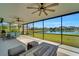 Spacious screened lanai overlooking a lake, offering serene views at 11467 Conch Ct, Venice, FL 34292
