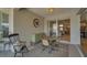 Charming patio with round table and chairs, ideal for morning coffee at 11467 Conch Ct, Venice, FL 34292