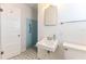 Small bathroom with blue tile shower and pedestal sink at 116 23Rd W St, Bradenton, FL 34205