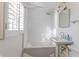 Bright bathroom with white subway tiles, bathtub, and updated fixtures at 116 23Rd W St, Bradenton, FL 34205
