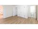 Bedroom with new flooring, double doors to closet, and ensuite bath at 116 23Rd W St, Bradenton, FL 34205