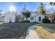 White single-story house with attached garage and landscaped yard at 116 23Rd W St, Bradenton, FL 34205