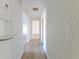 Clean hallway with new flooring and neutral walls at 116 23Rd W St, Bradenton, FL 34205