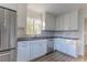 Modern white kitchen with stainless steel appliances and corner sink at 116 23Rd W St, Bradenton, FL 34205