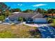 Single-story home with stone accents and a paved driveway at 1237 Flying Bridge Ln, Osprey, FL 34229