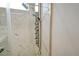 Walk-in shower with multiple shower heads and marble tile at 1378 Daryl Dr, Sarasota, FL 34232