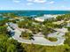 Aerial view of a parking area and nearby shops and restaurants at 14041 Bellagio Way # 315, Osprey, FL 34229