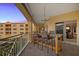 Outdoor balcony dining area with granite top table at 14041 Bellagio Way # 315, Osprey, FL 34229