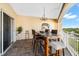 Outdoor balcony with table and chairs, offering water views at 14041 Bellagio Way # 315, Osprey, FL 34229