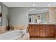 Spa-like bathroom with a soaking tub and double vanity at 14041 Bellagio Way # 315, Osprey, FL 34229