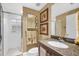 Bathroom with granite vanity and shower at 14041 Bellagio Way # 315, Osprey, FL 34229