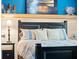 Bedroom with a queen-size bed and coastal decor at 14041 Bellagio Way # 315, Osprey, FL 34229