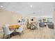 Community room with tables, chairs, and comfortable seating areas at 14041 Bellagio Way # 315, Osprey, FL 34229