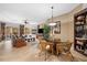 Open concept dining area with wicker chairs and glass top table at 14041 Bellagio Way # 315, Osprey, FL 34229