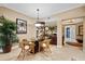 Bright dining area with a glass-top table and four chairs at 14041 Bellagio Way # 315, Osprey, FL 34229