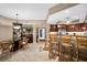 Open concept dining room with breakfast bar and seating at 14041 Bellagio Way # 315, Osprey, FL 34229