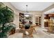 Dining area with a glass-top table and wicker chairs at 14041 Bellagio Way # 315, Osprey, FL 34229