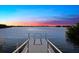 Private dock with access to the water at sunset at 14041 Bellagio Way # 315, Osprey, FL 34229