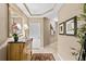 Elegant entryway with wood furniture and mirror at 14041 Bellagio Way # 315, Osprey, FL 34229