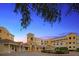 Elegant community building at sunset with fountain at 14041 Bellagio Way # 315, Osprey, FL 34229