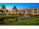 Luxury condo building with pond and fountain at 14041 Bellagio Way # 315, Osprey, FL 34229