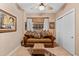 Cozy guest room featuring a comfortable sofa and built-in closet at 14041 Bellagio Way # 315, Osprey, FL 34229