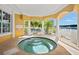 Relaxing hot tub with tranquil views and covered seating at 14041 Bellagio Way # 315, Osprey, FL 34229