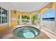 Relaxing hot tub with covered seating area and tranquil views at 14041 Bellagio Way # 315, Osprey, FL 34229