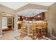 Kitchen with breakfast bar and dark wood cabinets at 14041 Bellagio Way # 315, Osprey, FL 34229