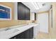 Convenient laundry room with washer, dryer, and utility sink at 14041 Bellagio Way # 315, Osprey, FL 34229