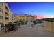 Private patio with fire pit and water views at 14041 Bellagio Way # 315, Osprey, FL 34229