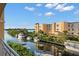 Luxury waterfront property with boats docked along the canal, offering stunning views at 14041 Bellagio Way # 315, Osprey, FL 34229