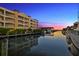 Beautiful waterfront sunset view with boats and reflections on calm waters at 14041 Bellagio Way # 315, Osprey, FL 34229