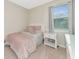 Cozy bedroom featuring a bed and nightstand at 17633 Cantarina Cv, Bradenton, FL 34211