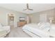 Primary bedroom with a king bed and sitting area at 17633 Cantarina Cv, Bradenton, FL 34211