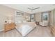 Spacious primary bedroom with sitting area and large windows at 17633 Cantarina Cv, Bradenton, FL 34211