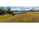 Community view showcasing homes and a tranquil pond at 17633 Cantarina Cv, Bradenton, FL 34211
